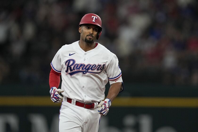 Texas Rangers' Marcus Semien runs the bases after hitting a three-run home run off Seattle Mariners starting pitcher Chris Flexen during the seventh inning of a baseball game Saturday, June 3, 2023, in Arlington, Texas. (AP Photo/Tony Gutierrez)