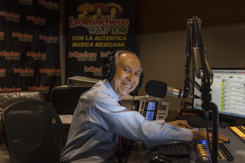 Burbank, CA - August 12: Ruben Miranda hosts his "El Rancho de Vicente Fernandez" radio show, which he has done for the past 21 years, a one-hour radio show that airs every weekday at noon on La Ranchera 96.7 at Estrella Media headquarters in Burbank Thursday, Aug. 12, 2021. (Allen J. Schaben / Los Angeles Times)