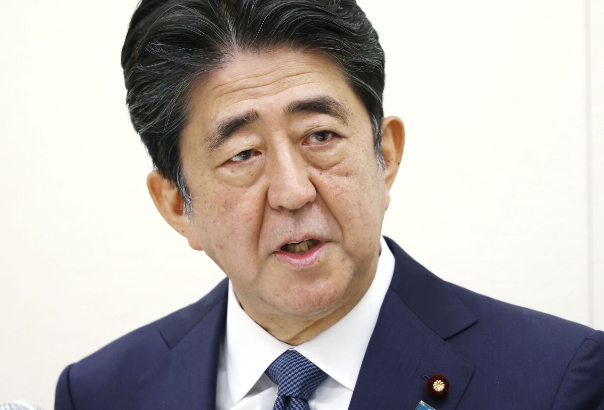 Former Japanese Prime Minister Shinzo Abe speaks during a press conference in Tokyo on Thursday. 