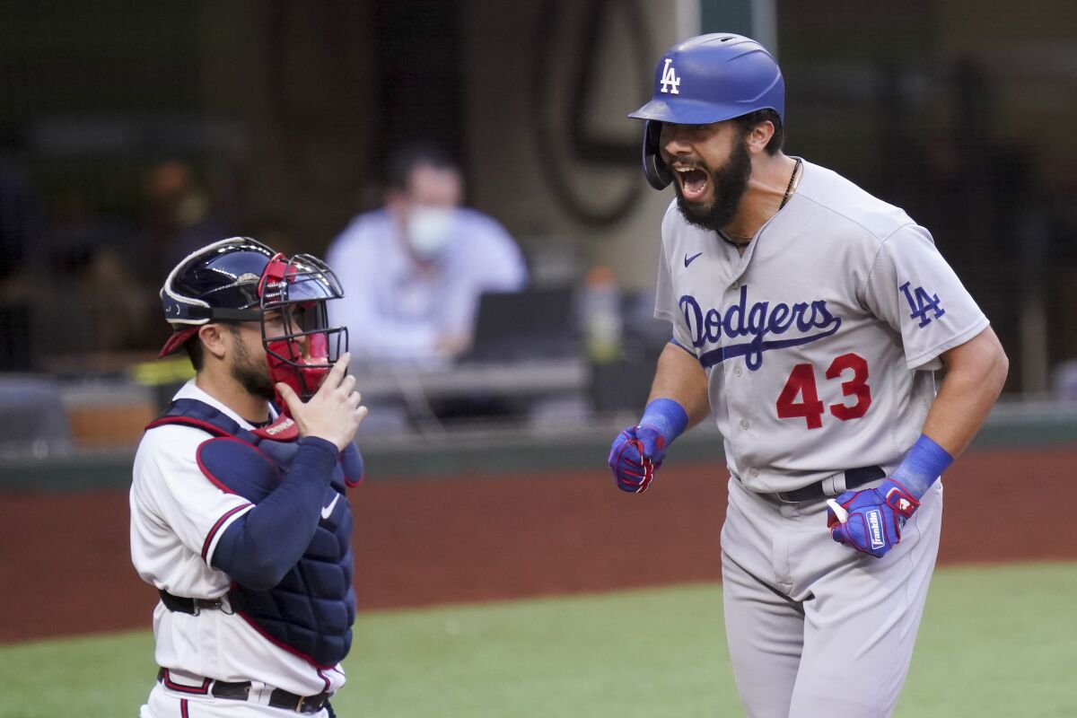 The Dodgers' Edwin Rios celebrates his home run against the Braves during Game 3 of the 2020 NLCS 