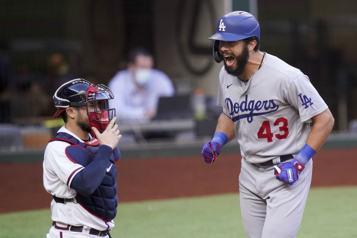 The Dodgers' Edwin Rios celebrates his home run against the Braves during Game 3 of the 2020 NLCS