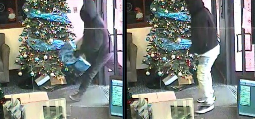Surveillance images show two armed men suspected of robbing a California Bank & Trust branch Friday morning in Kearny Mesa