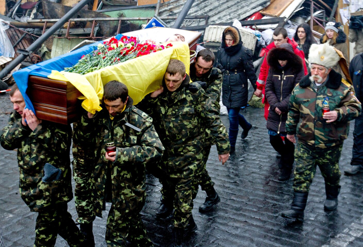 Members of a "self-defense" unit carry a friend's coffin in Kiev this month.