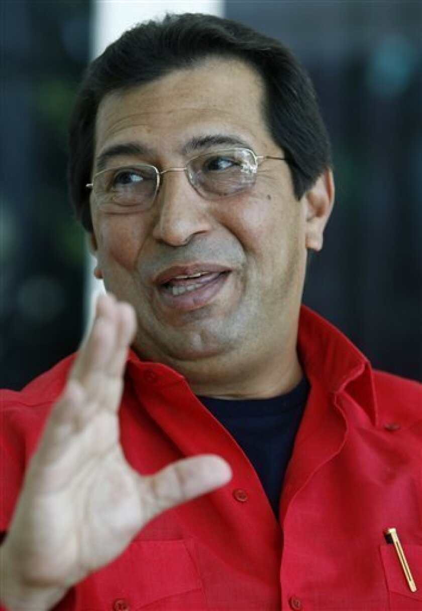 In this April 7, 2006 file photo Adan Chavez, Venezuela's ambassador to Cuba and Hugo Chavez's older brother, smiles during an interview with the Associated Press at his home in Havana, Cuba. (AP Photo/ Javier Galeano, File)