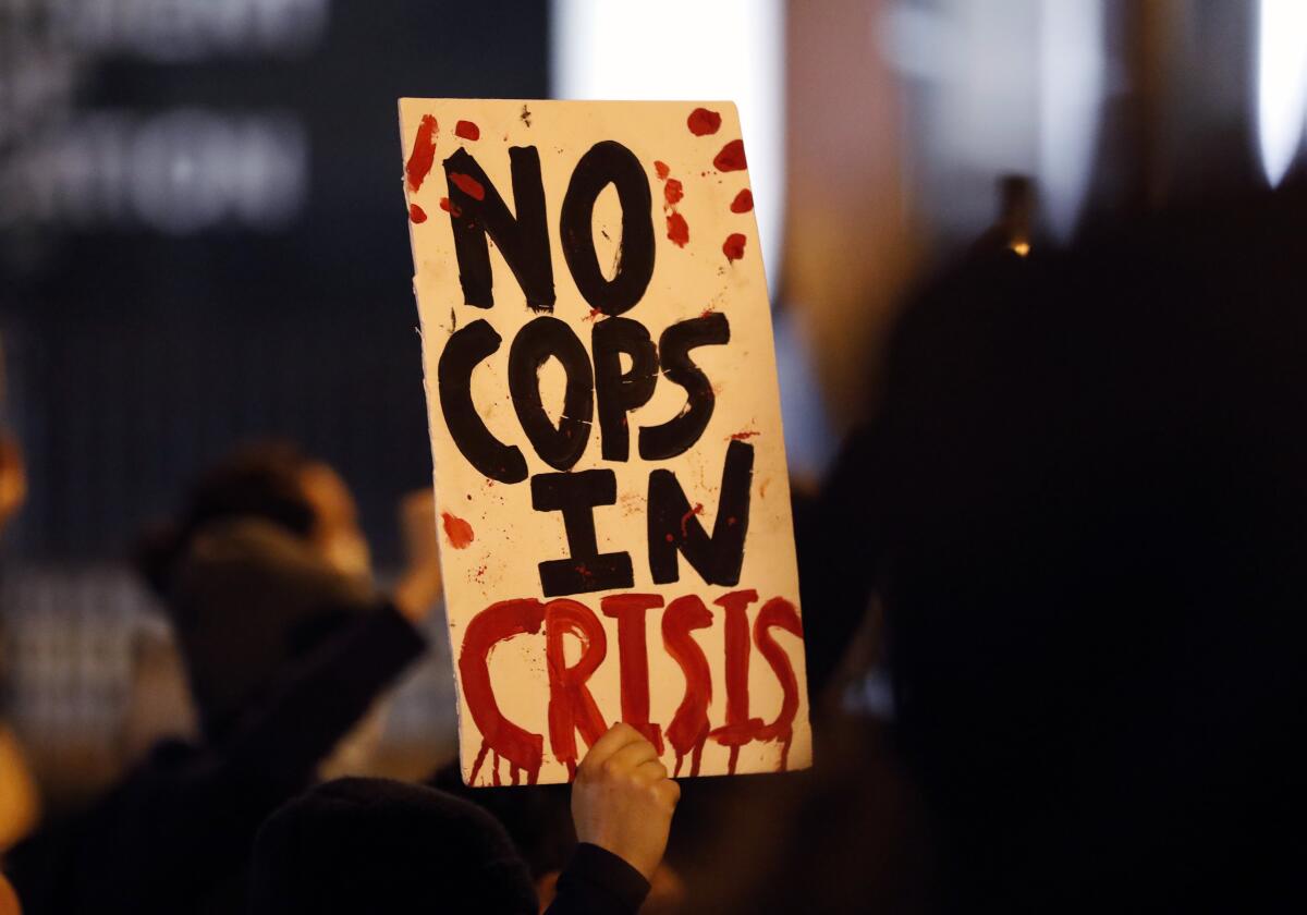 Protesters march up North Front Street, demonstrating against Monday's fatal shooting of a Black man in downtown Columbus, Ohio, on Tuesday, April 13, 2021. Miles Jackson was shot and killed inside Mount Carmel by police in Westerville, Ohio. (Kyle Robertson /The Columbus Dispatch via AP)