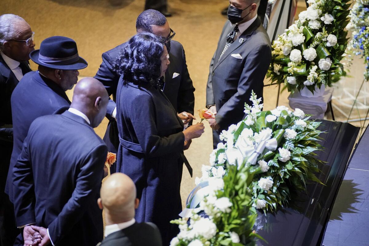 RowVaughn Wells stops in front of the casket of her son Tyre Nichols