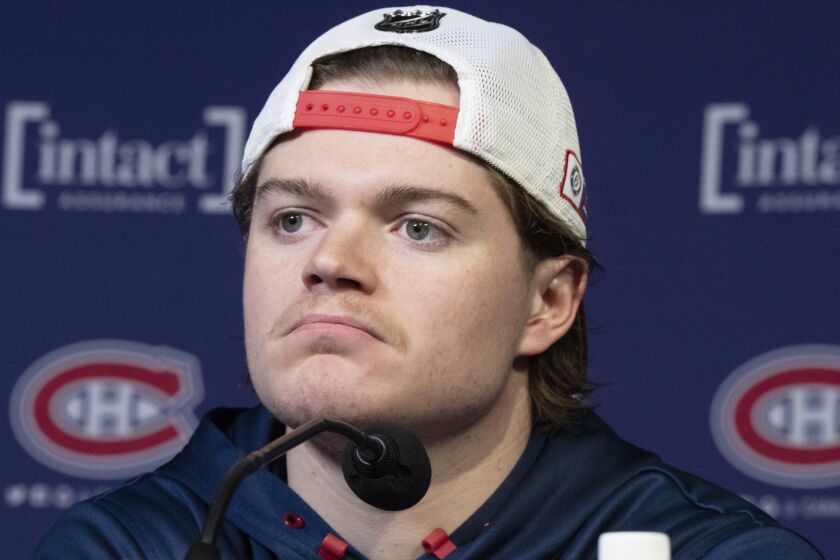 Montreal Canadiens NHL hockey forward Cole Caufield speaks to the media about his season-ending shoulder injury Friday, Jan. 27, 2023, in Montreal. (Ryan Remiorz/The Canadian Press via AP)