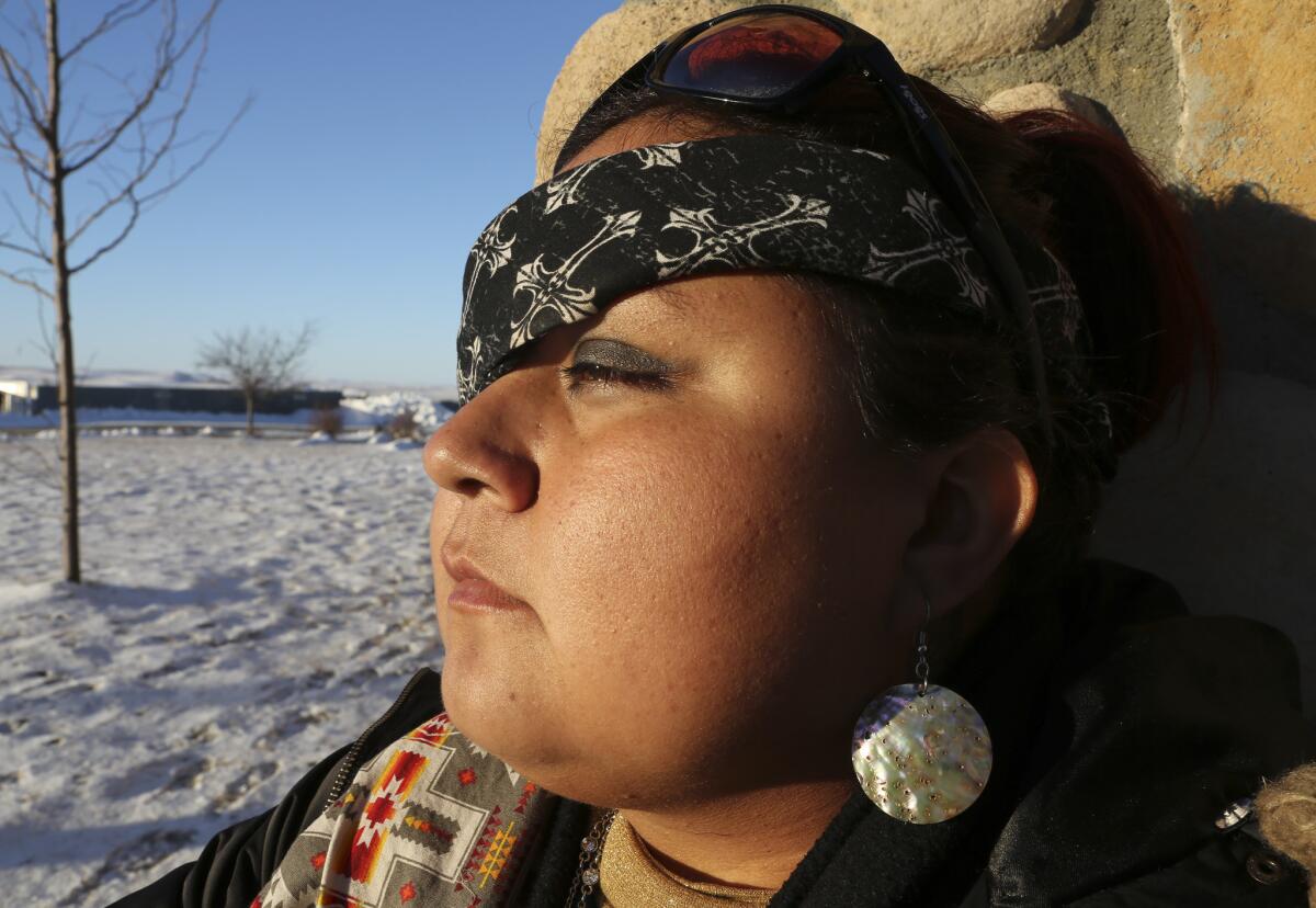 Vanessa Dundon wears a bandana to cover her injured eye.