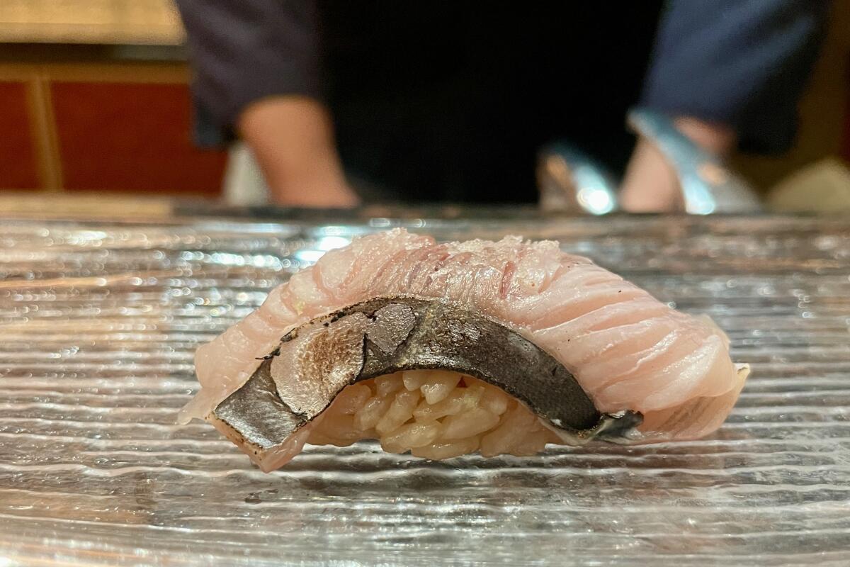 A piece of mackeral nigiri from Mizuki Tempura & Sushi in Singapore.