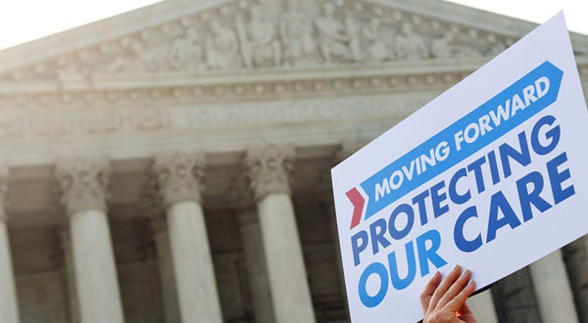 Demonstrators protest the Affordable Care Act outside the U.S. Supreme Court in June. The high court has permitted a group to argue two claims against the healthcare law in a lower court.