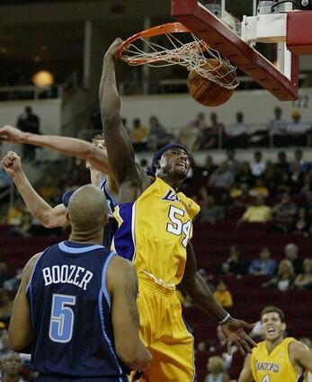 Los Angeles Lakers' Kwame Brown dunks over the Utah Jazz's Carlos Boozer.