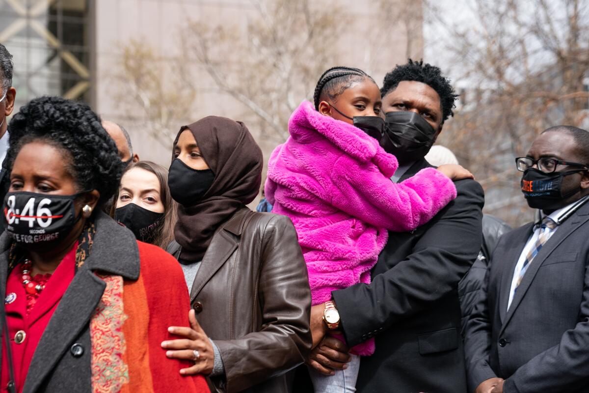 Rep. Sheila Jackson Lee, left, the Rev. Jesse Jackson and Rep. Ilhan Omar attend a prayer Monday led by the Rev. Al Sharpton.