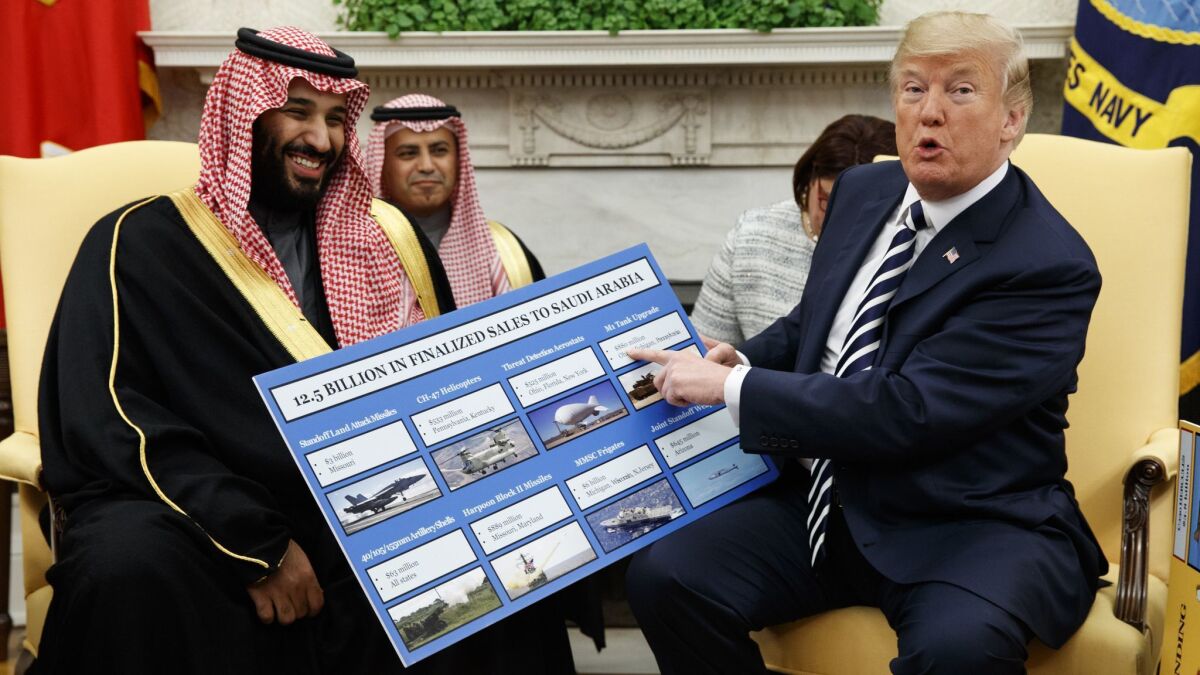 President Trump shows a chart highlighting arms sales to Saudi Arabia during a meeting with Saudi Crown Prince Mohammed bin Salman on March 20, 2018, in the Oval Office.