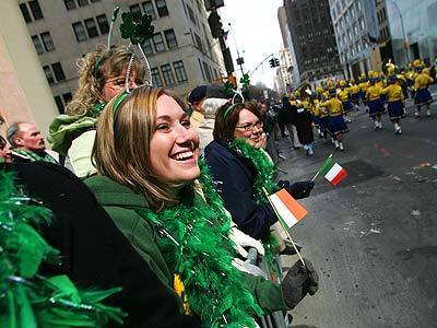 Sundee Taylor of Mesa, Ariz., watches the St. Patrick's Day Parade in New York. The parade drew thousands of residents and tourists.