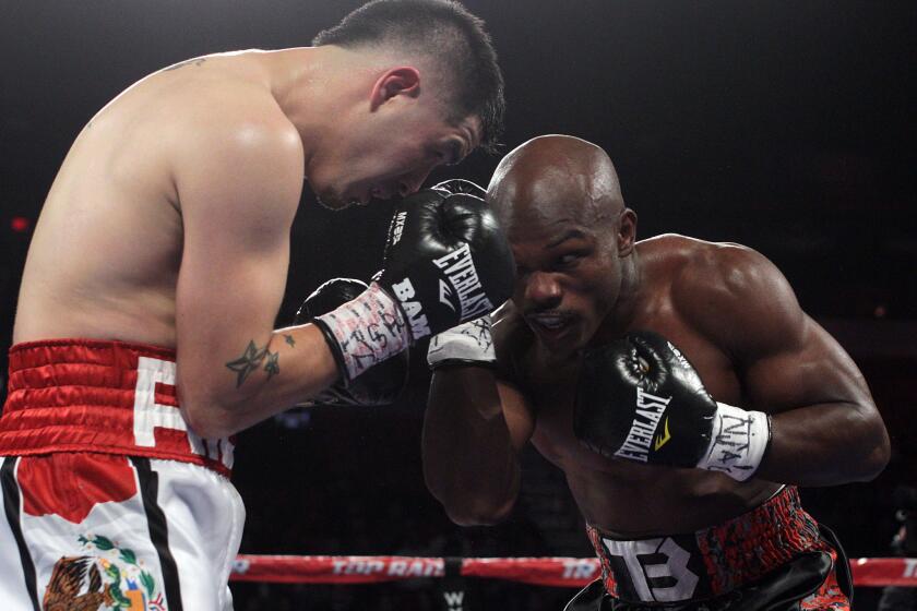 Timothy Bradley Jr., right, works inside against Brandon Rios during their WBO welterweight title fight in Las Vegas on Saturday night.