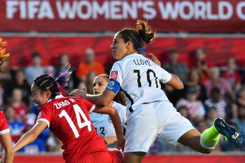 U.S. midfielder Carli Lloyd watches her header over China's Rong Zhao go into the net for a goal in the second half of a Women's World Cup quarterfinal on Friday at T.D. Place in Ottawa.