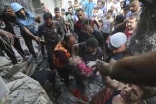 CORRECTS DATE Palestinians rescue a child from under the rubble after Israeli airstrikes in Gaza City, Gaza Strip, Wednesday, Oct. 18, 2023. (AP Photo/Abed Khaled)