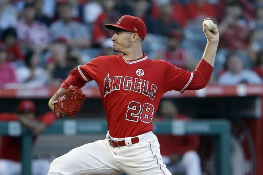 Los Angeles Angels starting pitcher Andrew Heaney throws to a Houston Astros batter during the first inning of a baseball game Tuesday, July 16, 2019, in Anaheim, Calif. (AP Photo/Marcio Jose Sanchez)