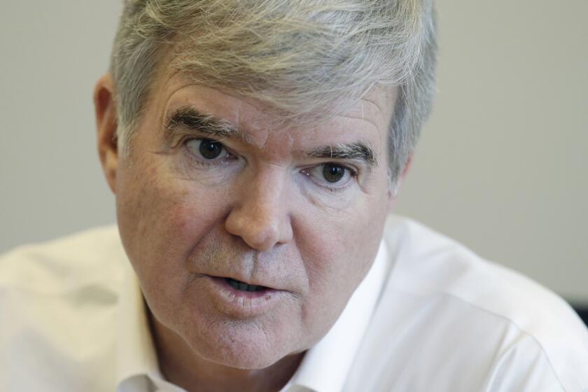 NCAA President Mark Emmert responds to a question during an interview in Indianapolis on Oct. 27.