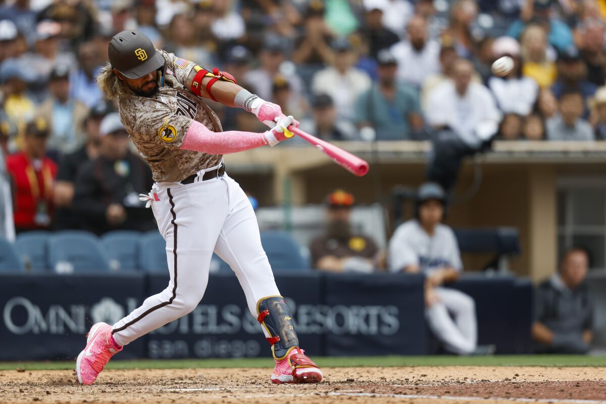 Padres pinch hitter Jorge Alfaro hits a game-winning, three-run homer against the Marlins on Sunday at Petco Park.