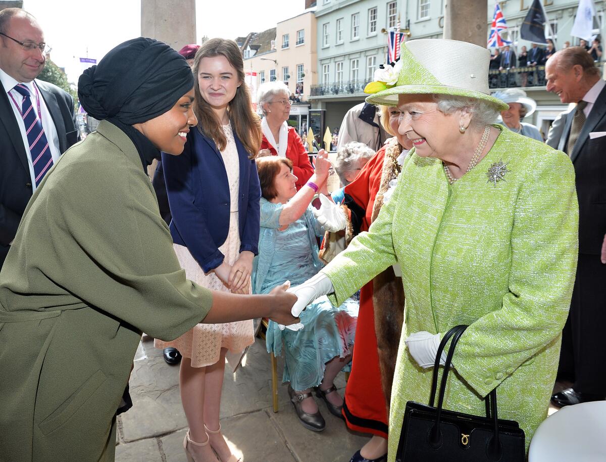 Queen Elizabeth II meets Nadiya Hussain, winner of the Great British Bake Off, during her 90th Birthday Walkabout on April 21, 2016 in Windsor, England.