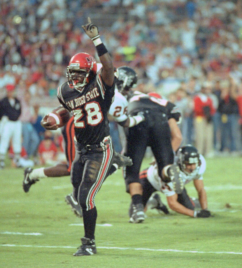 SDSU freshman Marshall Faulk set NCAA records for rushing yards (386) and touchdowns (7) in 1991 game against Pacific.