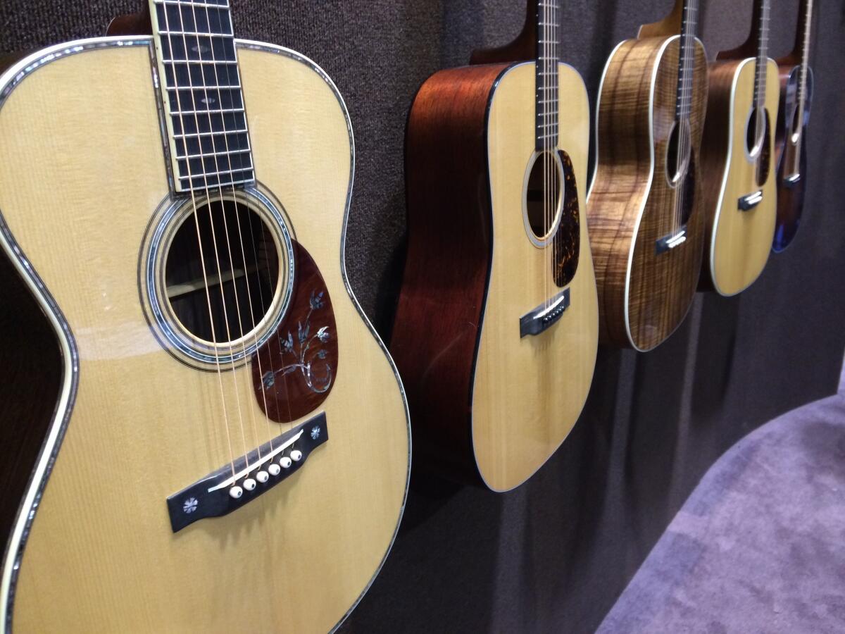 Martin's line of Authentic Series guitars, including the OM-45 De Luxe Authentic 1930, left.
