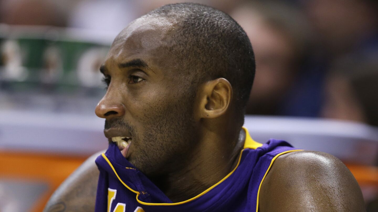 Lakers star Kobe Bryant looks on from the bench during the second half of a 110-91 loss to the Indiana Pacers on Monday.