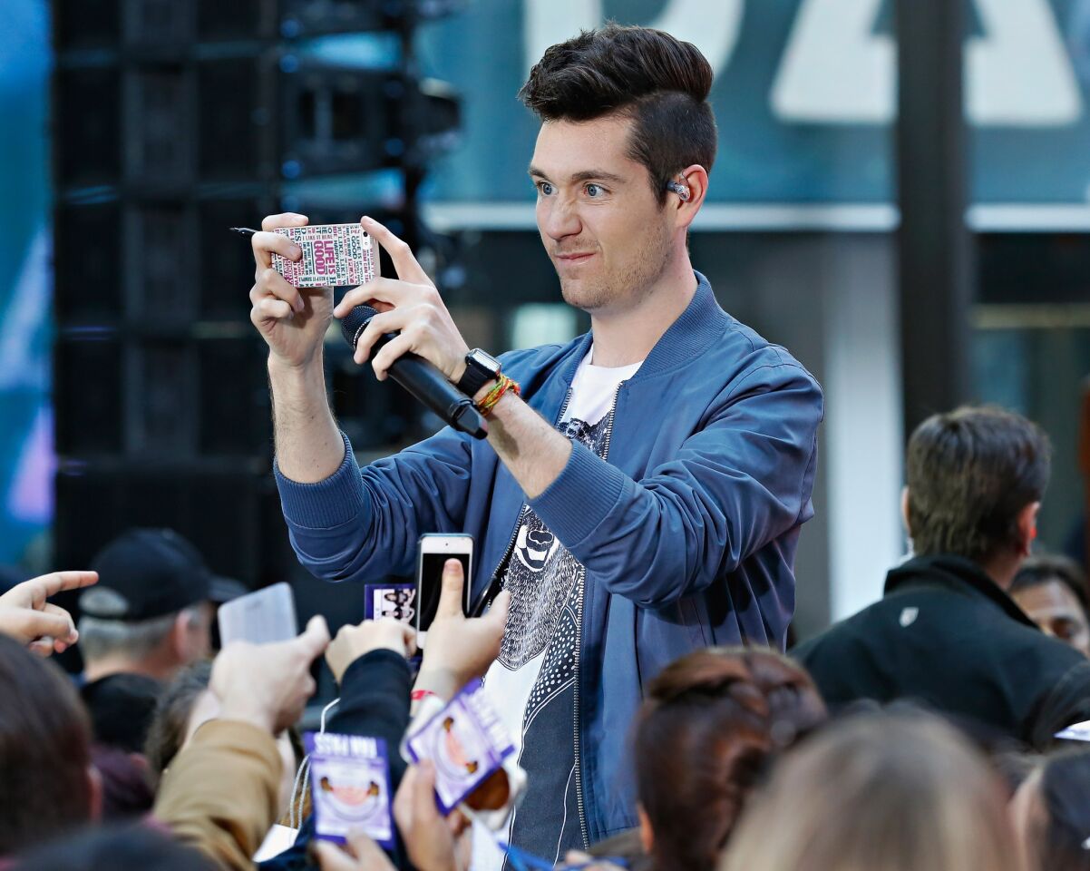 Dan Smith takes a selfie during a performance with Bastille on NBC's "Today" on Oct. 6, 2014, in New York.
