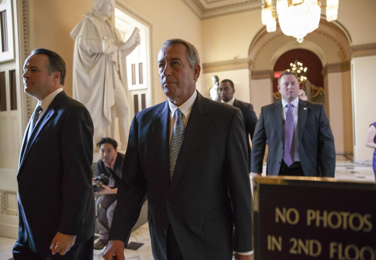 Speaker of the House John A. Boehner (R-Ohio) walks to the chamber as the House failed to advance a short-term funding measure to keep the Department of Homeland Security funded past a midnight deadline.