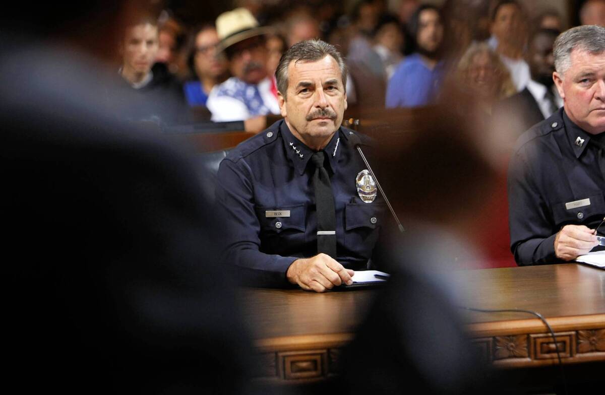 Los Angeles Police Chief Charlie Beck, shown before the L.A. City Council in July, warned Thursday that police officers will be in danger of layoffs unless the city proceeds with a ballot measure to increase its sales tax by a half-cent.