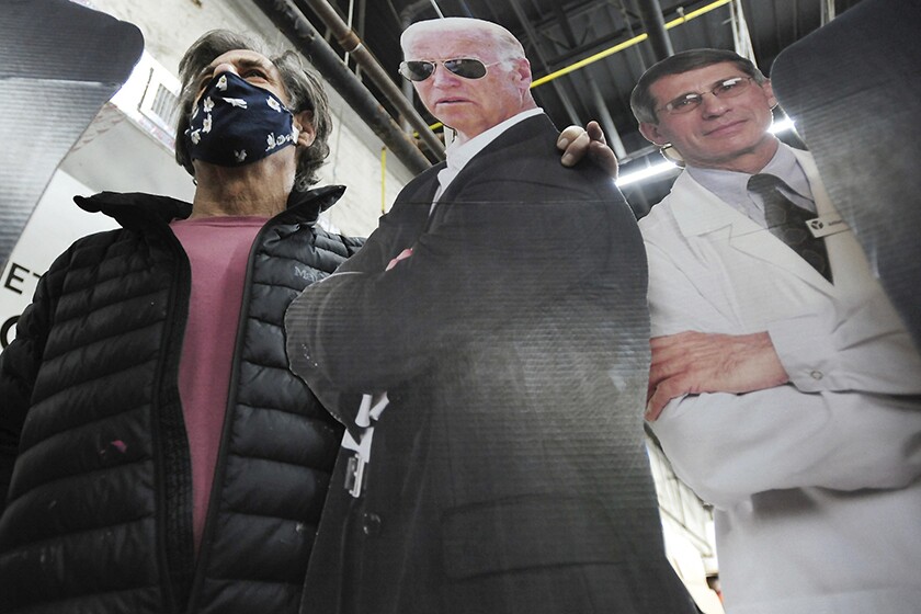 Stephen Taren with life-sized cutouts of President Joe Biden with Dr. Anthony Fauci.
