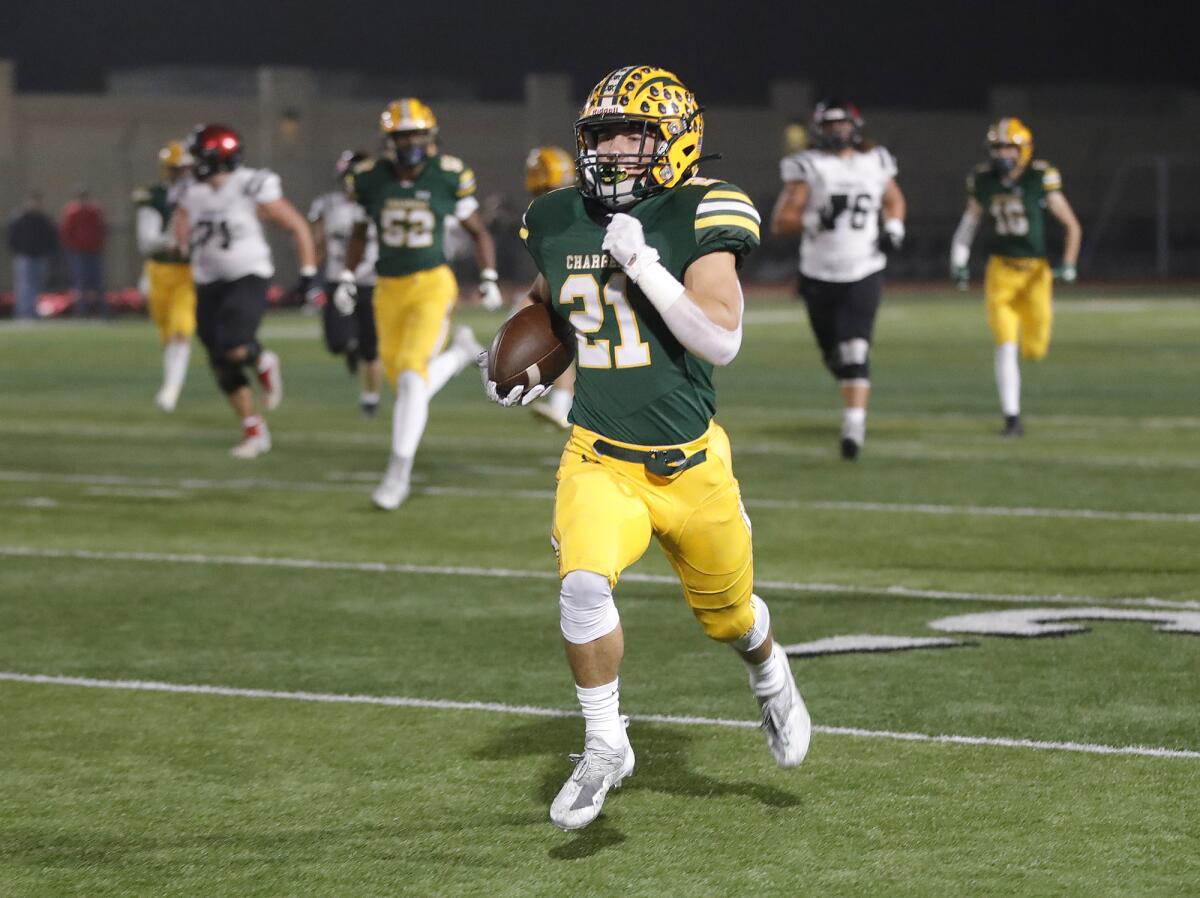 Edison's Troy Fletcher runs down the sideline for a touchdown after intercepting a pass against Murrieta Valley on Nov. 5.