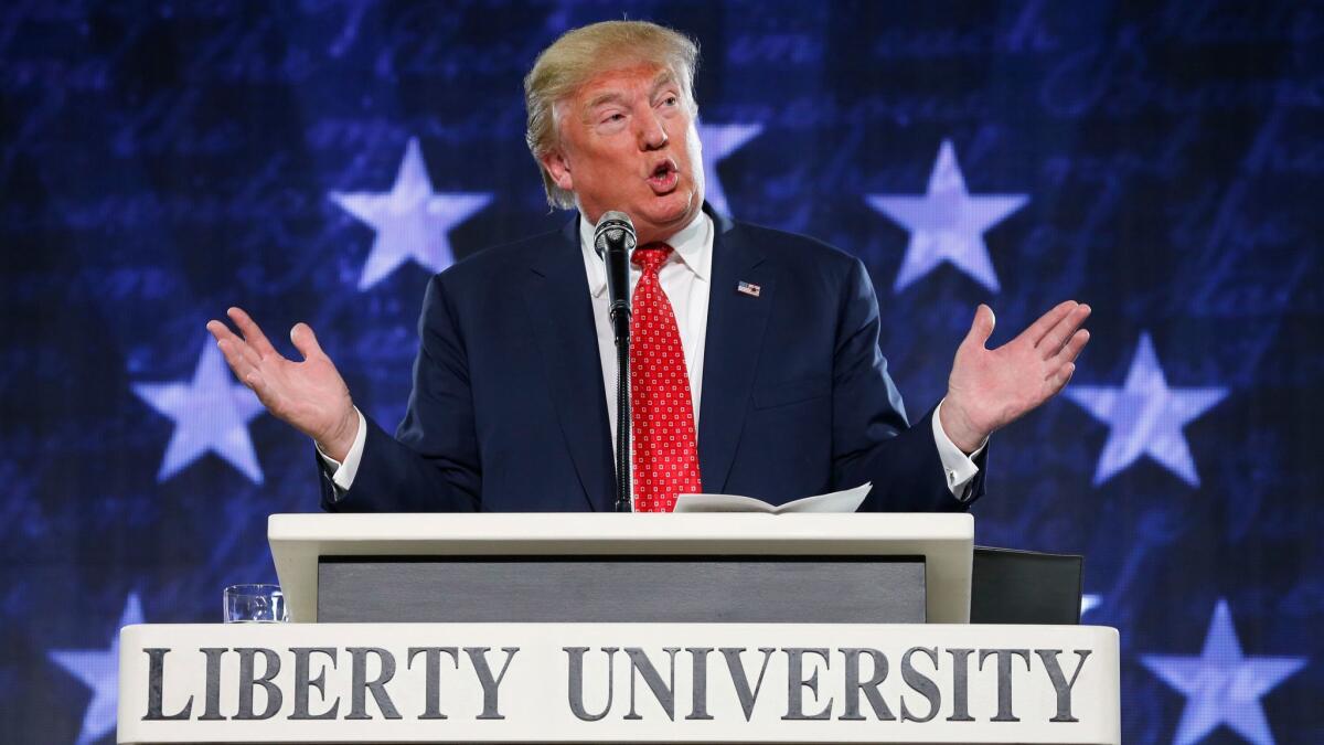 Donald Trump gestures during a speech at Liberty University in Lynchburg, Va. on Jan. 18, 2016.