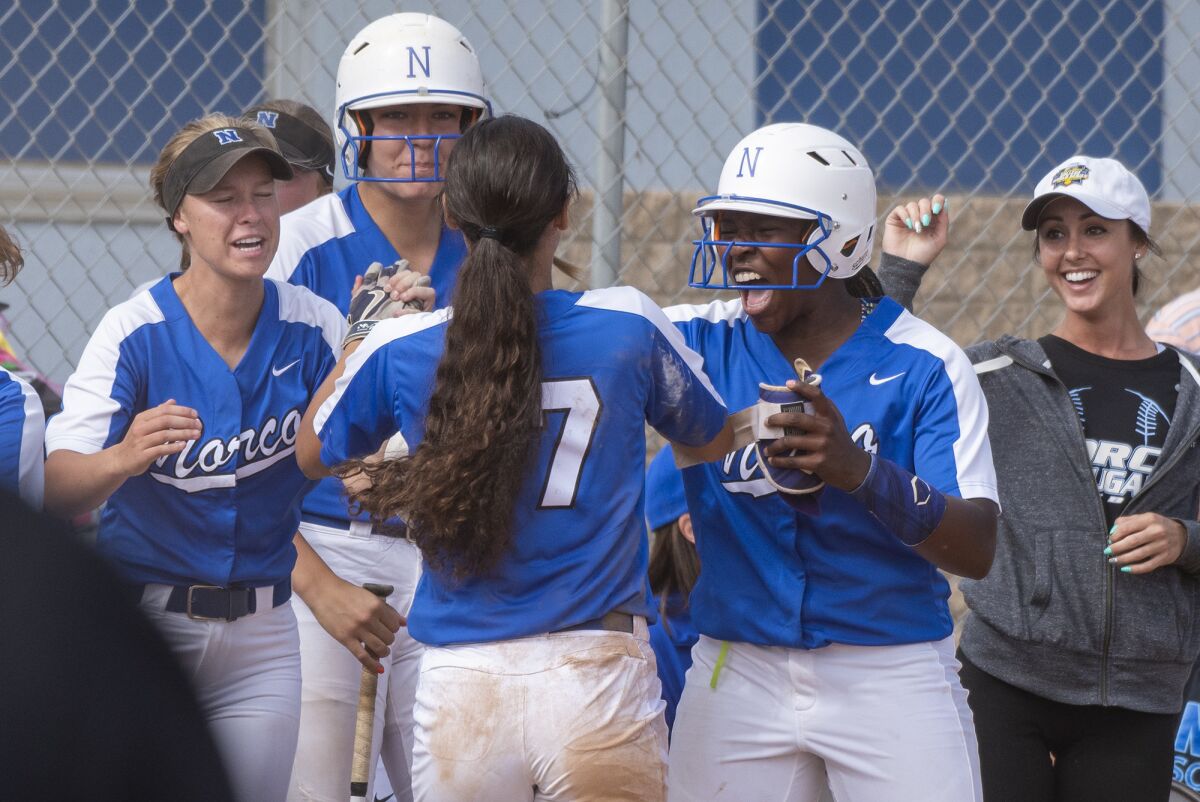 Norco's Nicole Rodriguez gets high-fives after scoring during a quarterfinal CIF Southern Section Division 1 playoff game on May 24.