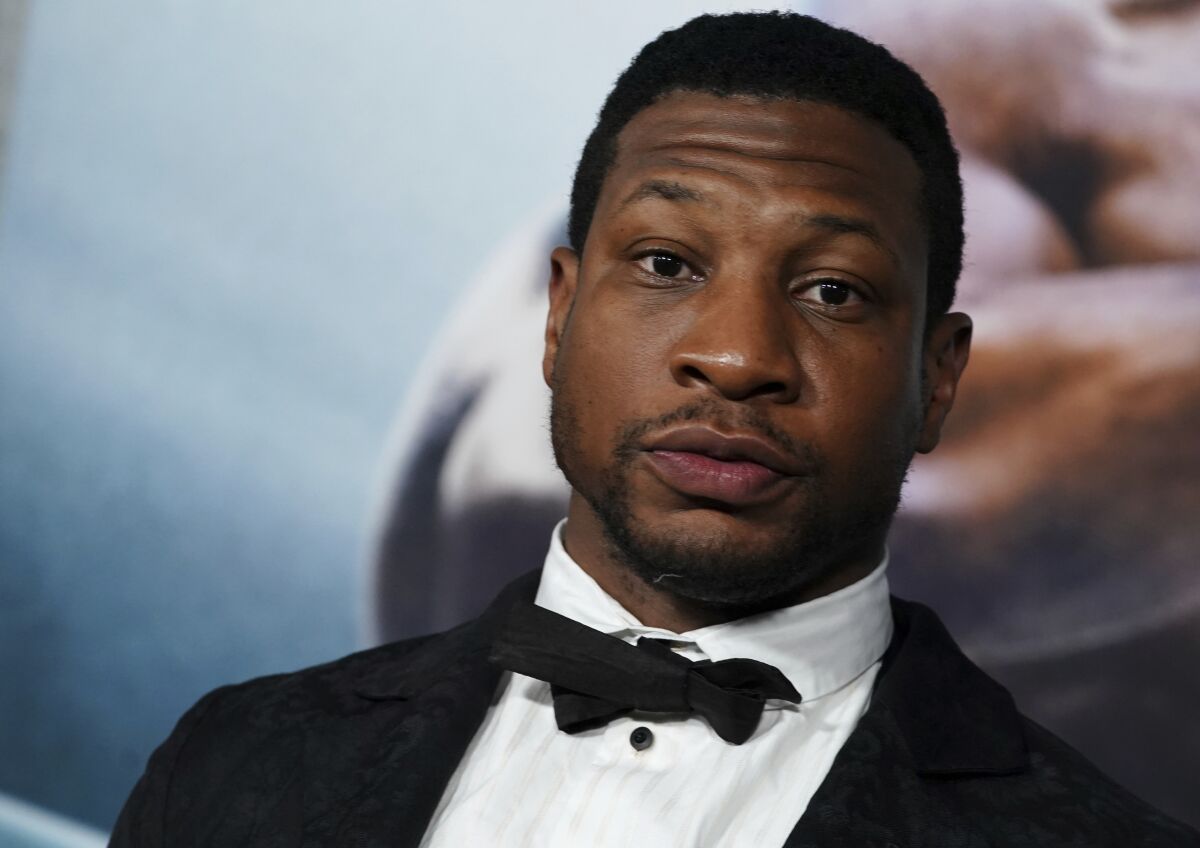 FILE - Jonathan Majors arrives at the premiere of "Creed III" on Feb. 27, 2023, at TCL Chinese Theatre in Los Angeles. The arrest of actor Majors on Saturday, March 25, 2023, has upended the Army’s newly launched advertising campaign that was aimed at reviving the service’s struggling recruiting numbers. (Photo by Jordan Strauss/Invision/AP, File)