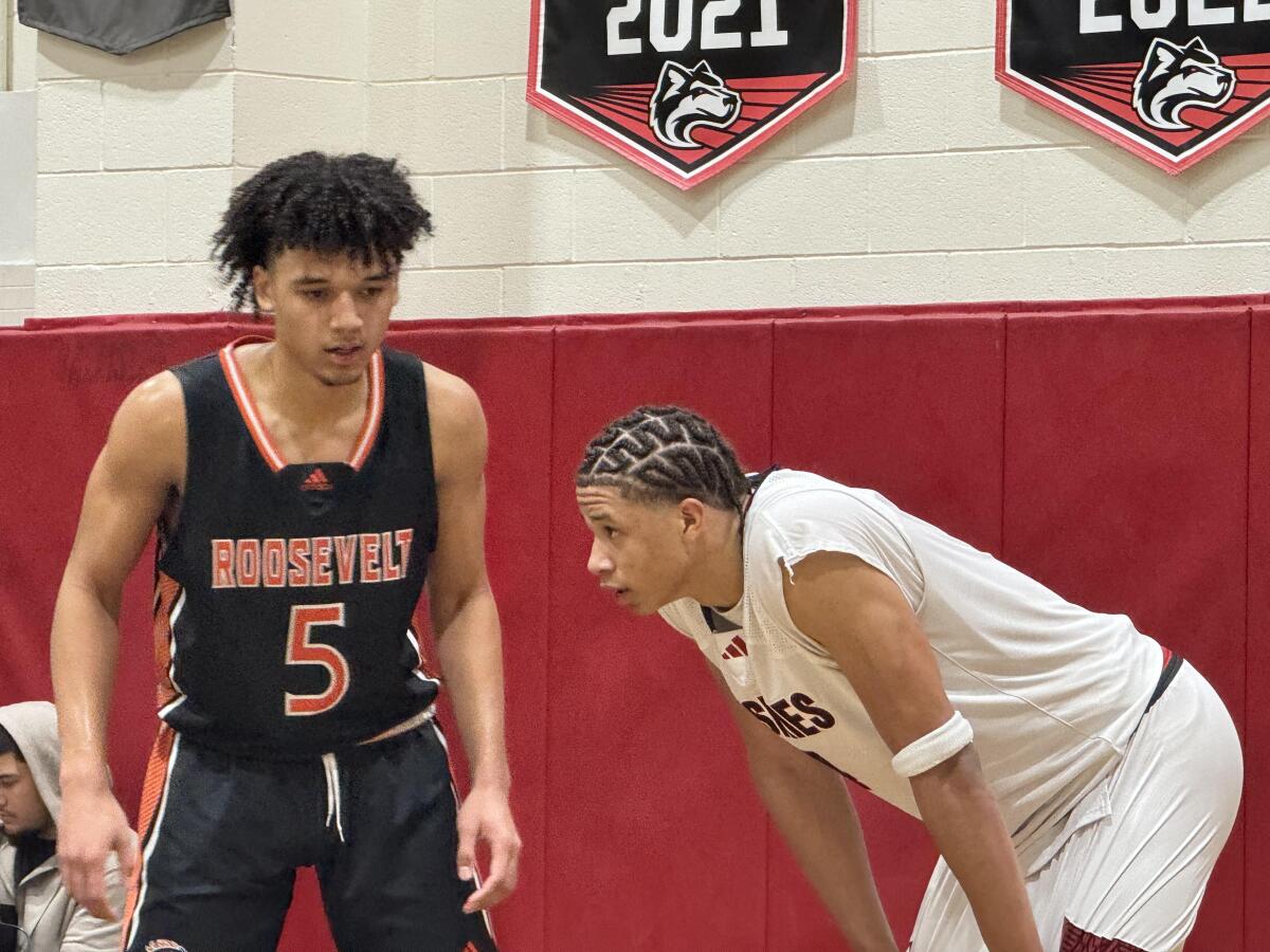 Carter Bryant, right, of Corona Centennial and Brayden Burries of Roosevelt dueled on Tuesday night. Centennial won 82-78.