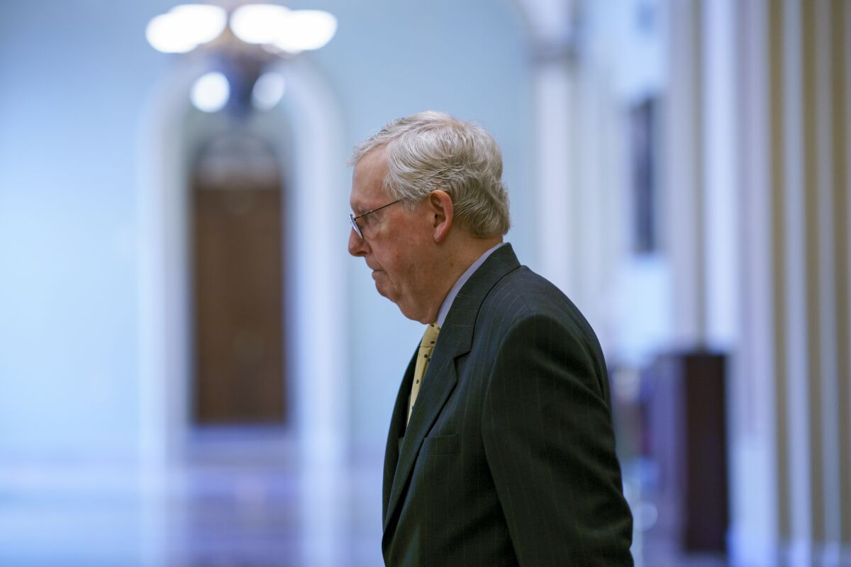 Senate Minority Leader Mitch McConnell, R-Ky., arrives as lawmakers work to advance the $1 trillion bipartisan infrastructure bill, at the Capitol in Washington, Wednesday, Aug. 4, 2021. (AP Photo/J. Scott Applewhite)