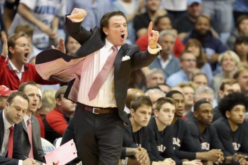 Louisville Coach Rick Pitino yells to his team during a game against North Carolina at the Tar Heels' Dean Smith Center on Wednesday.