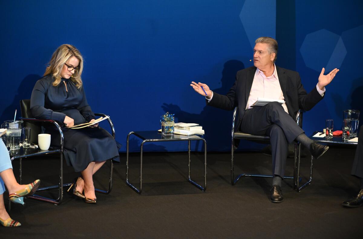 West Hollywood City Council member Lindsay Horvath and Sen. Bob Hertzberg debate on stage at the Hammer Museum