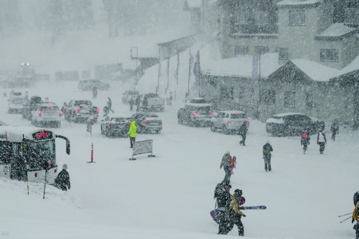 Snow falls at Mammoth Mountain Ski Area in Mammoth Lakes, Calif., Sunday, Feb. 5, 2023. A blustery weekend storm added to California's big mountain snowpack, leaving icy conditions in the Sierra Nevada early Monday. (Samantha Deleo/Mammoth Mountain via AP)