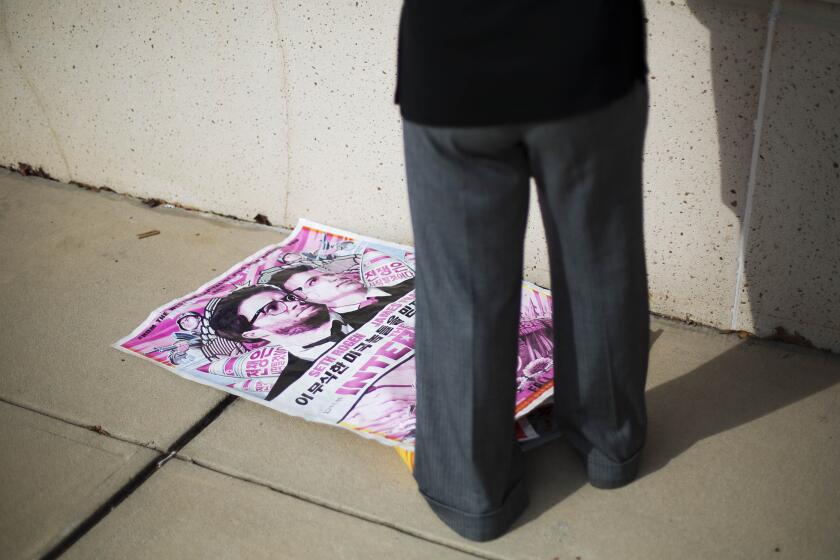 A poster for "The Interview" lies on the ground after being pulled from a display case by a worker at a movie theater in Atlanta on Dec. 17.