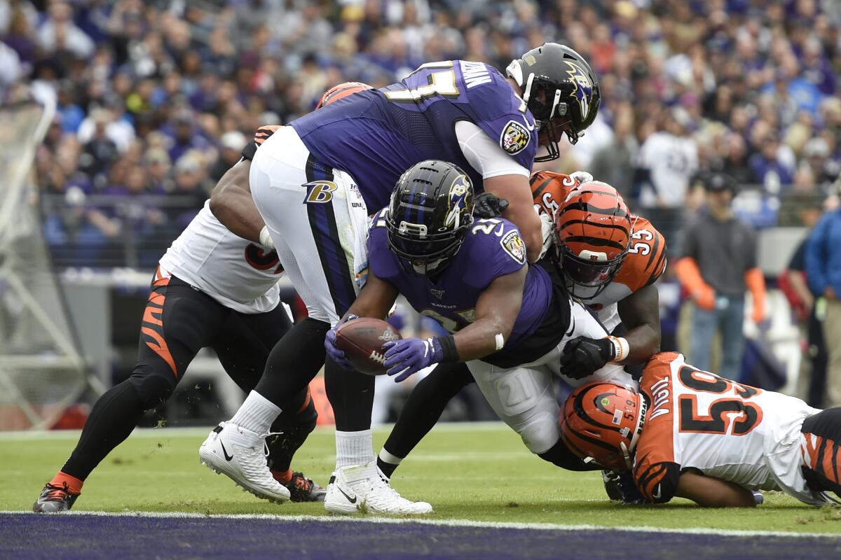 Baltimore Ravens running back Mark Ingram dives for a touchdown against the Cincinnati Bengals on Sunday at M&T Stadium.