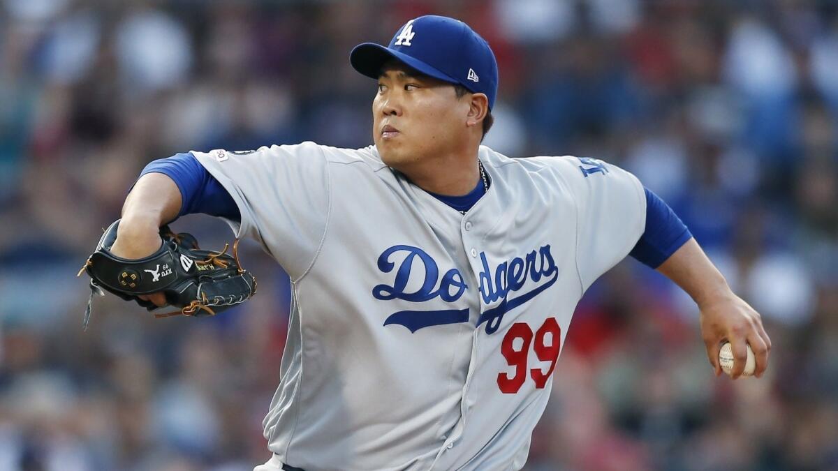 Dodgers starter Hyun-Jin Ryu delivers during the first inning of a 7-4 victory over the Boston Red Sox on Sunday.