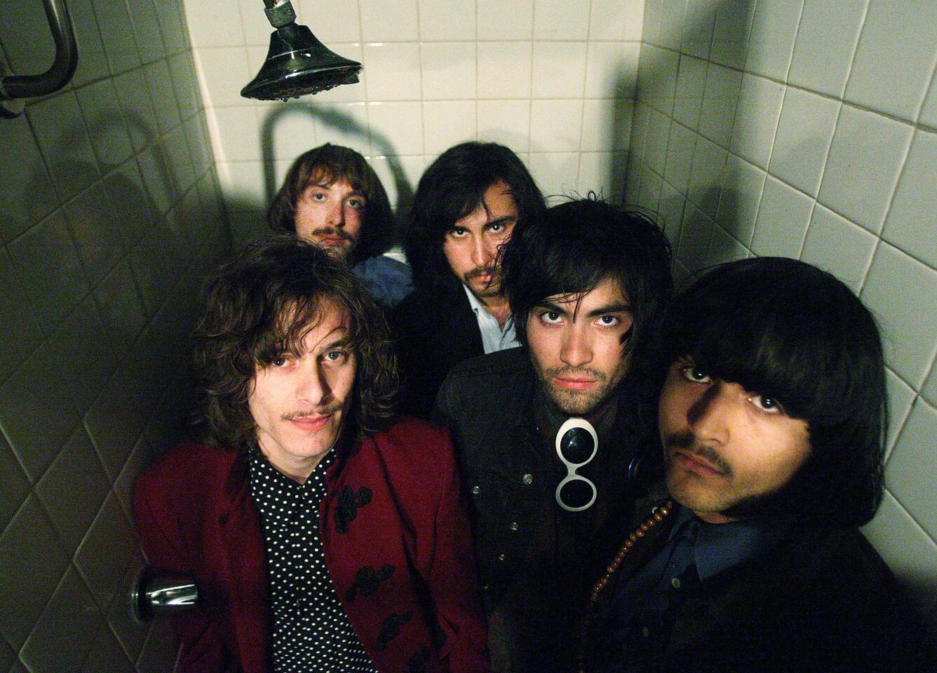 Julian Ducatenzeiler, Cameron Gartung, Tony Malacara, Ignacio Gonzalez, and Shane Stotsenberg of the band Mystic Braves pose for a group portrait in a shower stall in the Green Room at The Echo in Los Angeles on Monday, April 14, 2014.