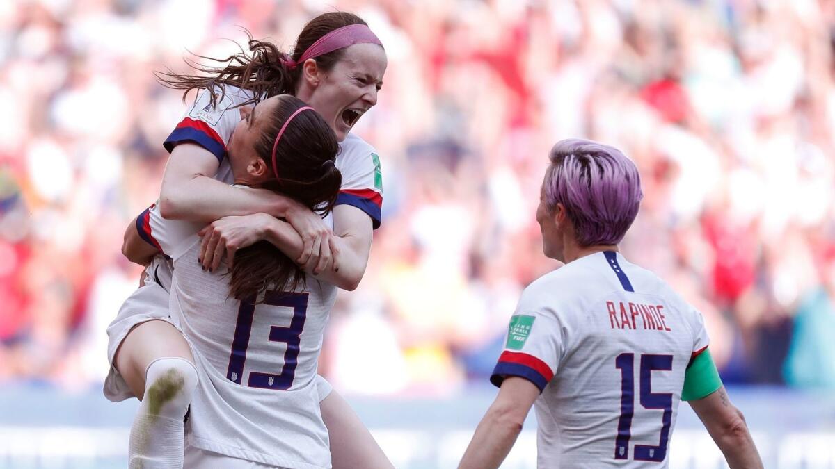 U.S. midfielder Rose Lavelle, top, celebrates with teammates Alex Morgan, left, and Megan Rapinoe after scoring during the 69th minute of a 2-0 victory over the Netherlands in the Women's World Cup final on Sunday.
