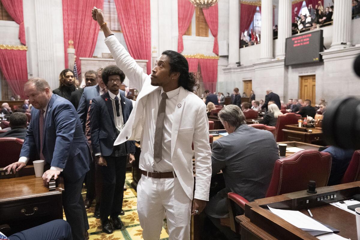 State Rep. Justin Jones gestures as he walks to his desk after Tennessee Republicans voted to oust him on April 6.