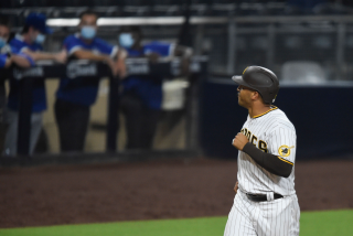 San Diego Padres' Trent Grisham looks to the Dodgers dugout after hitting a solo home run during the sixth inning