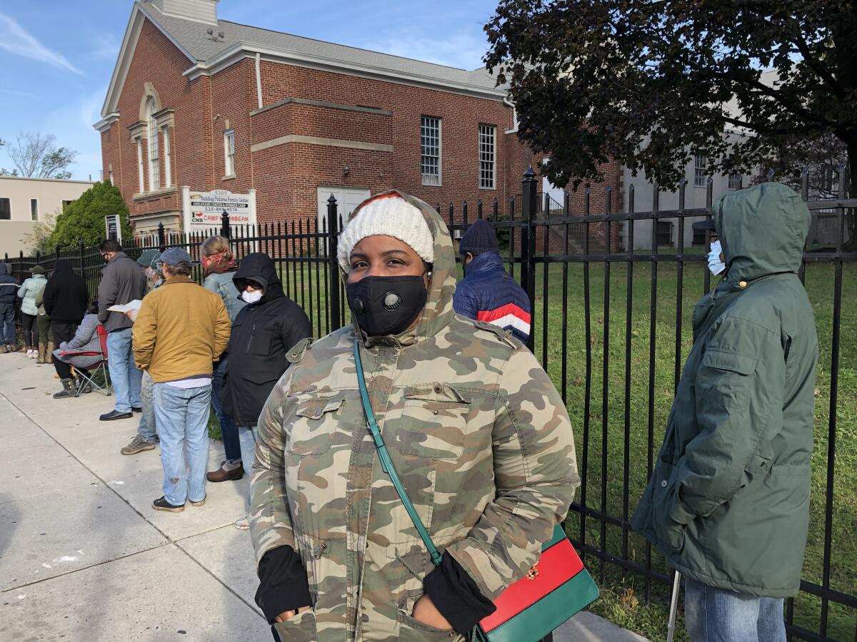 Home health aide Melissa Davis waits to vote at a Philadelphia church.