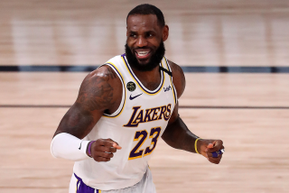 Lakers star LeBron James smiles during a game.